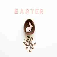 Free photo easter word and rabbit in chocolate egg