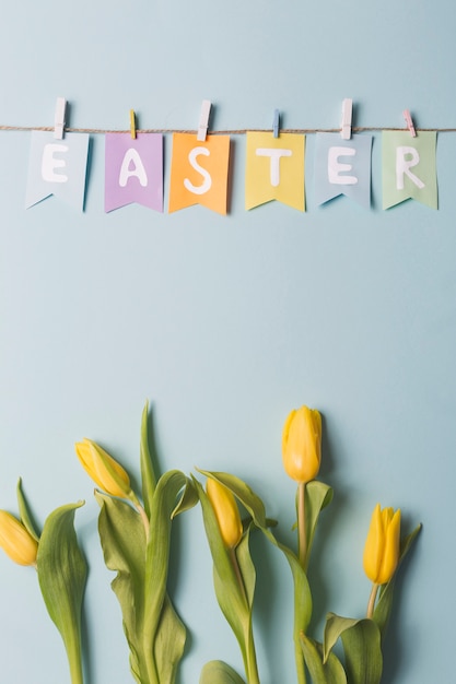 Free photo easter writing near tulips