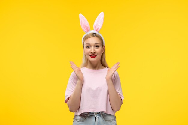 Easter young cute pretty girl with bunny ears excited waving hands