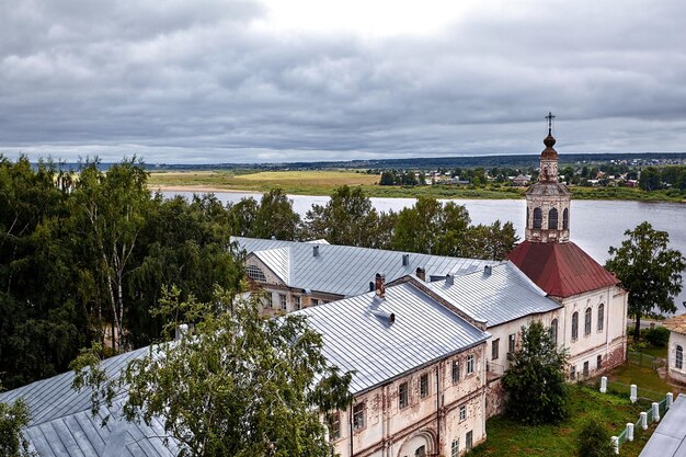 Eastern orthodox crosses on gold domes, cupolas, against blue sky with clouds. Orthodox church