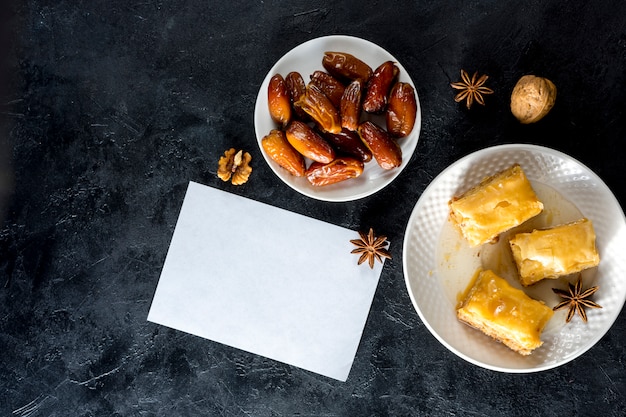 Eastern sweets with dates fruit and paper