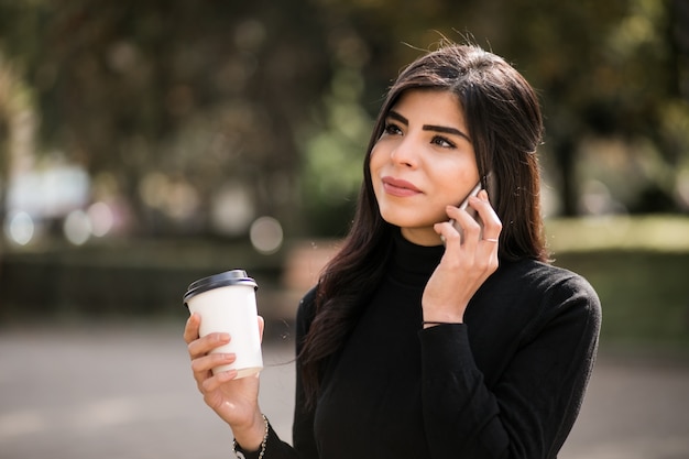 Eastern woman with phone