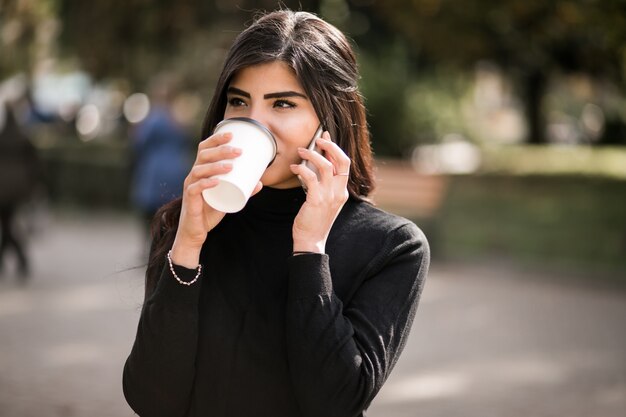 Eastern woman with phone