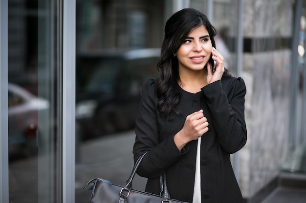 Eastern woman with phone