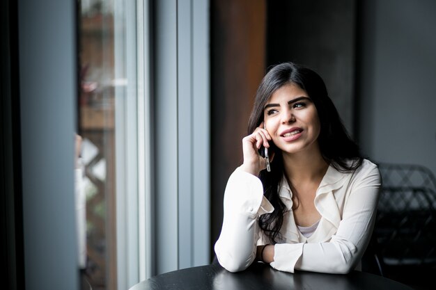 Eastern woman with phone