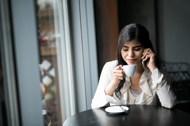 Eastern woman with phone