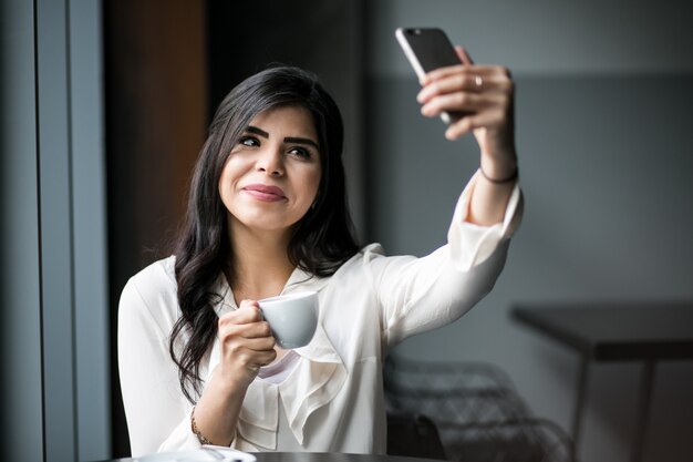 Eastern woman with phone