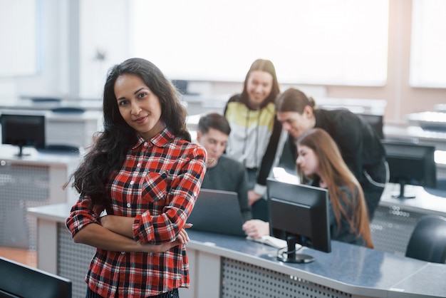 Easy and fun. Group of young people in casual clothes working in the modern office