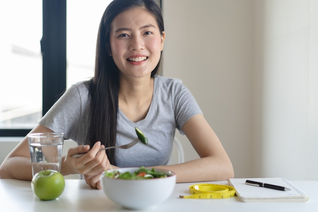 Eat healthy food on wellness lifestyle. woman eating salad.