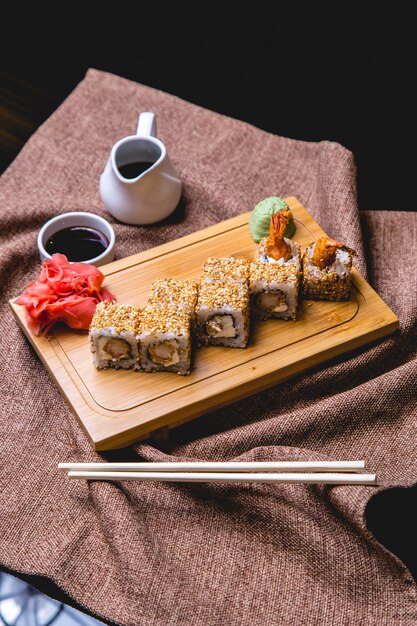 Ebi maki on wooden board side view