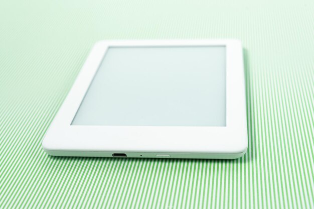 Ebook reader over green striped background