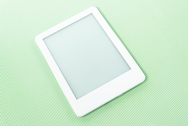 Ebook reader over green striped background