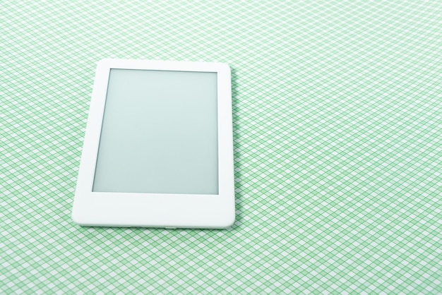 Free photo ebook reader over green striped background