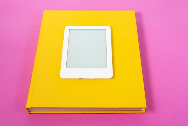 Free photo ebook reader over pink background