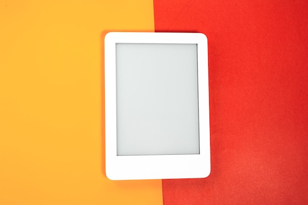 Ebook reader over yellow and red background