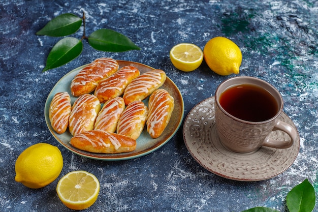 Eclairs or profiteroles with white chocolate and white chocolate