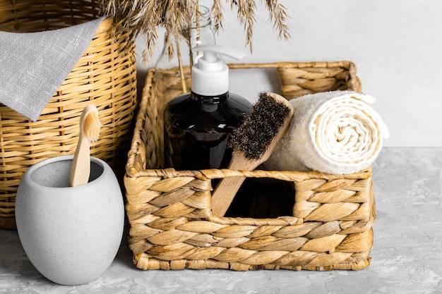 Eco-friendly cleaning products set in basket with brushes and toothbrush