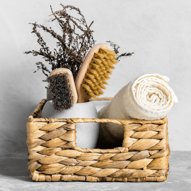 Eco-friendly cleaning products set in basket with brushes