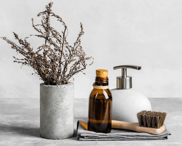 Eco-friendly cleaning products set on table with brush