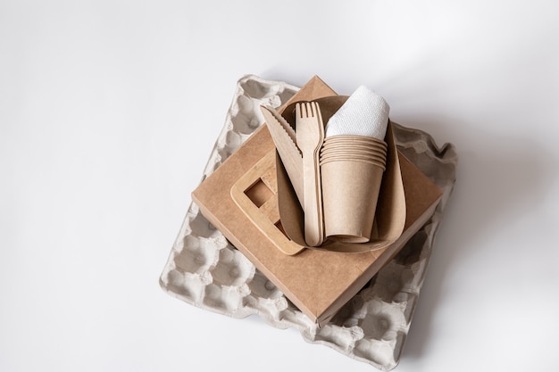 Eco-friendly disposable utensils made of bamboo wood and paper. Plastic free and zero waste concept. The concept of zero waste and plastic free.