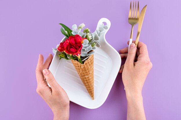 Eco ice cream cone with flowers top view