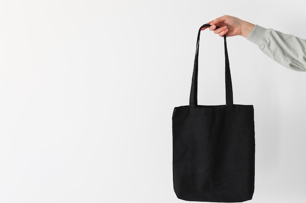 Эко-сумка для покупок в черном цвете, баннер с копией пространства, заботящийся о природе, с использованием вещей многоразового использования