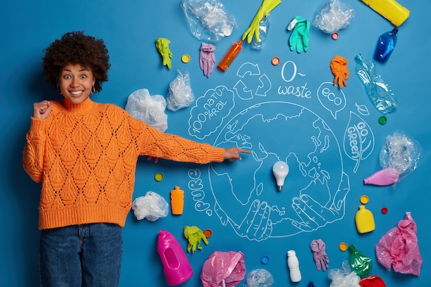 Eco volunteer next to environment wastes collage