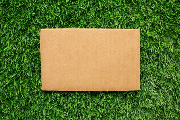 Free photo ecological paper sheet on grass