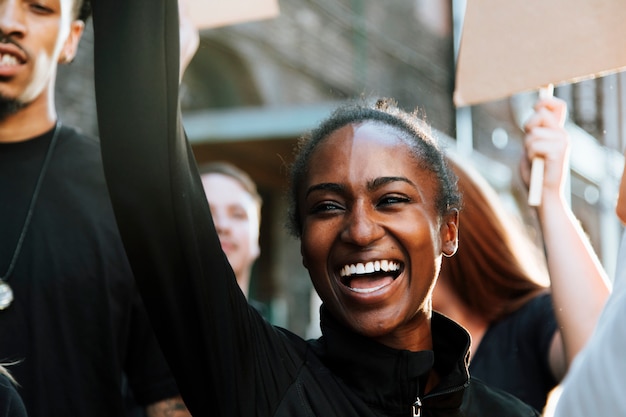 Free photo ecstatic protesters marching through the city