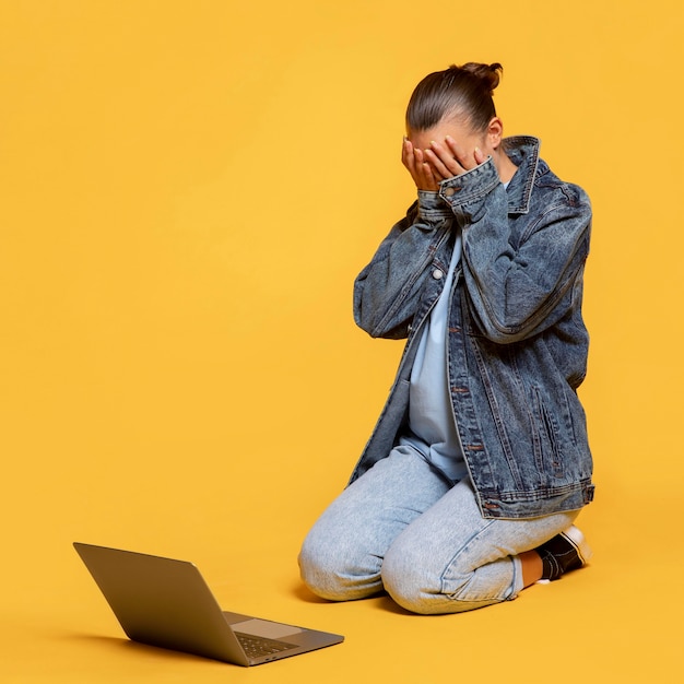 Free photo ecstatic woman with laptop