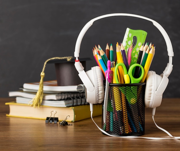 Education day arrangement on a table with headphones