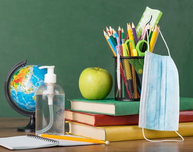 Education day arrangement on a table with medical mask