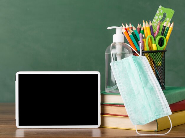 Education day arrangement on a table with a tablet