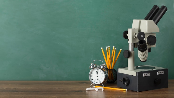 Free Photo education day assortment with microscope