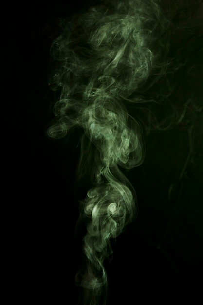 Effect of green smoke on black background