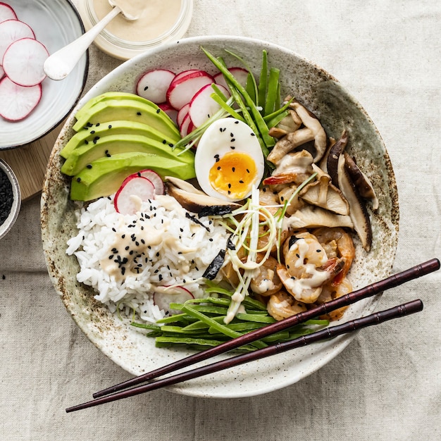 Egg and prawn served with tahini sauce in flat lay photography style