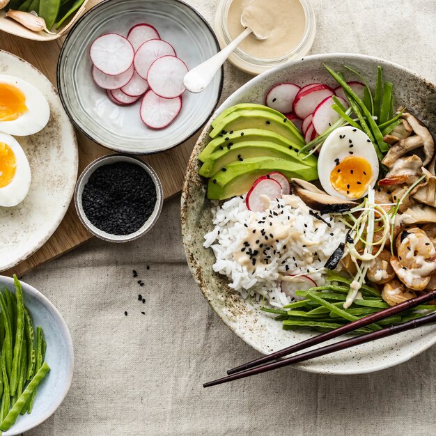 Egg and prawn served with tahini sauce in flat lay photography style