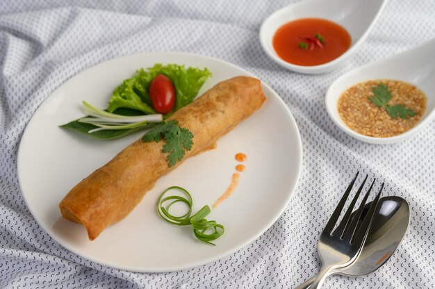 Egg roll or Fried Spring Rolls on the white plate Thai food. .