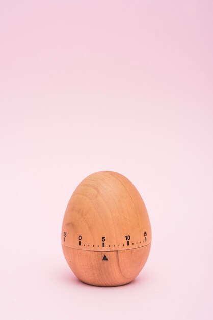 Egg timer on pink background 