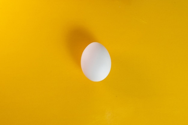Free photo egg on the yellow background