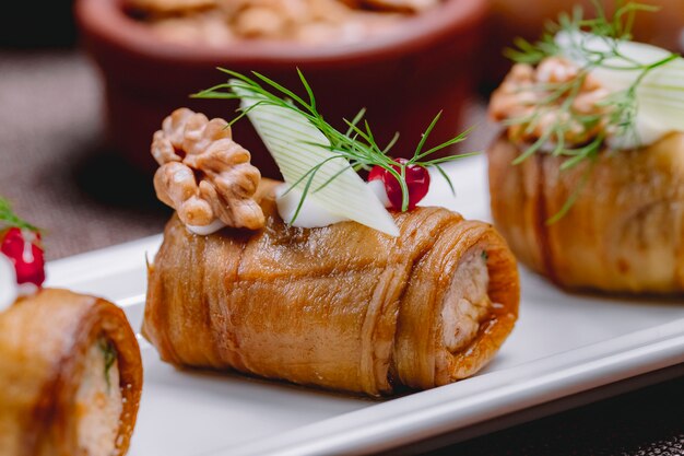 Eggplant roll walnuts garlic greens onion cream cheese side view