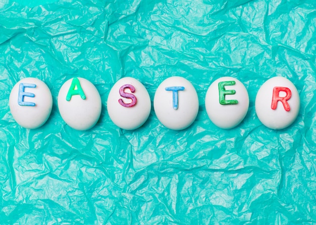 Eggs decorated by letters Easter in row