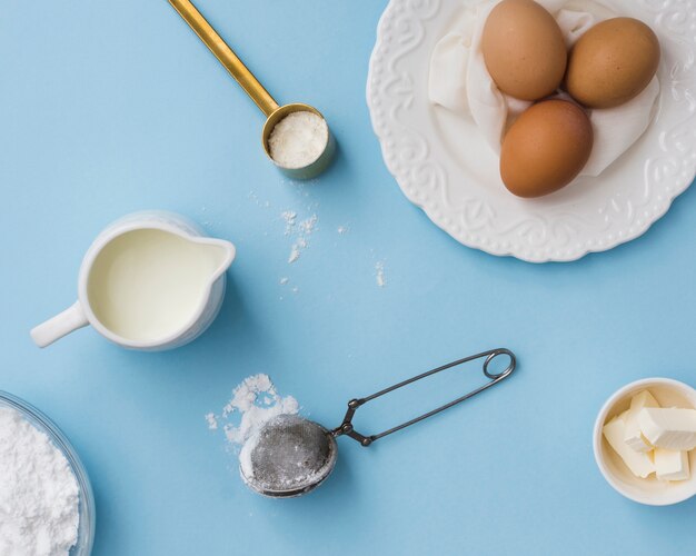 Eggs and flour in flat lay