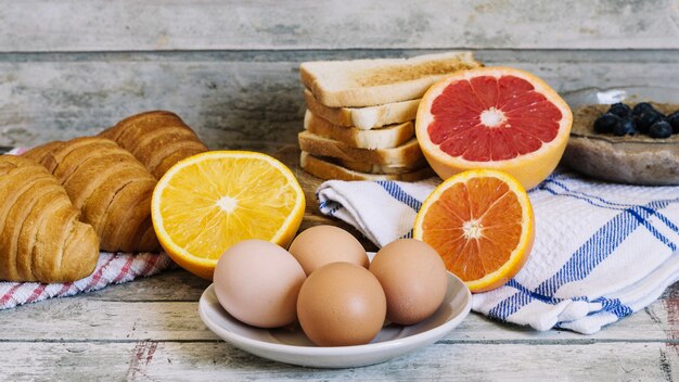 Eggs and fruits on table