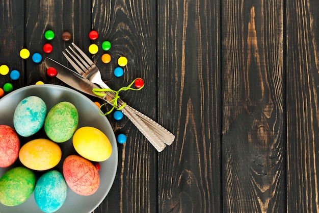 Eggs near cutlery and sweets