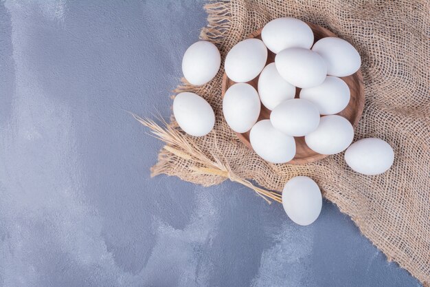 Eggs on a piece of rustic burlap.