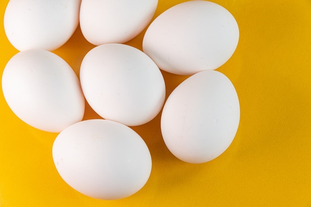 Eggs on the yellow background