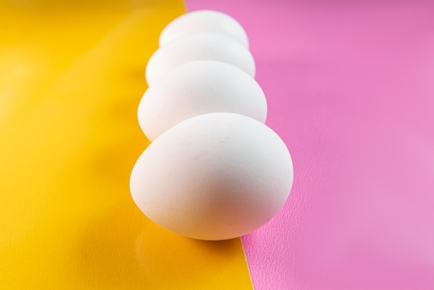 Eggs on the yellow and pink table