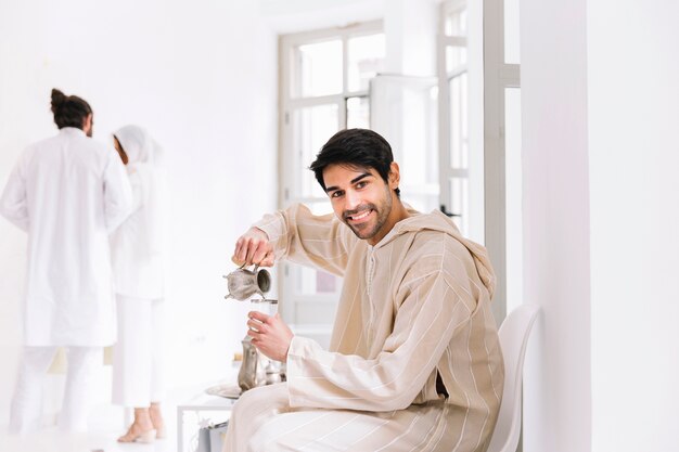 Eid al-fitr concept with man and tea