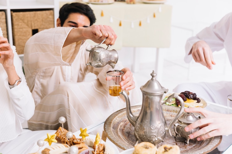 Free Photo eid al-fitr concept with tea and friends